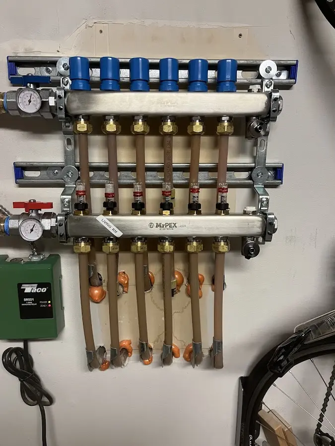 Plumber performing Water Heater Repair at a residential property in West Tisbury